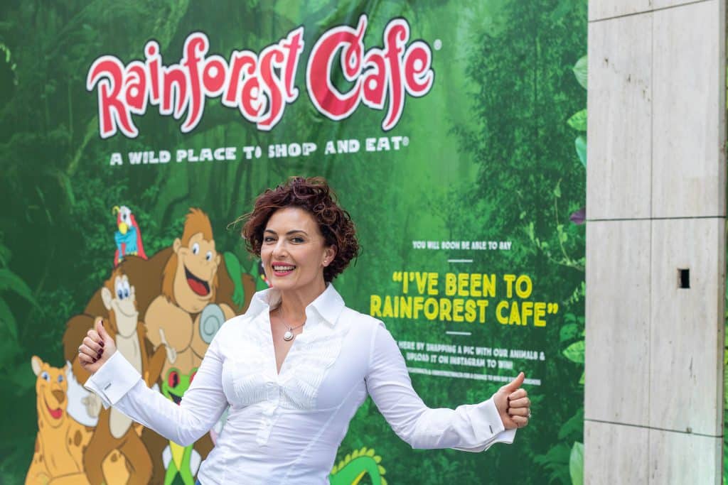 Clare Agius with the hoarding of Rainforest Cafe restaurant in St Julians’